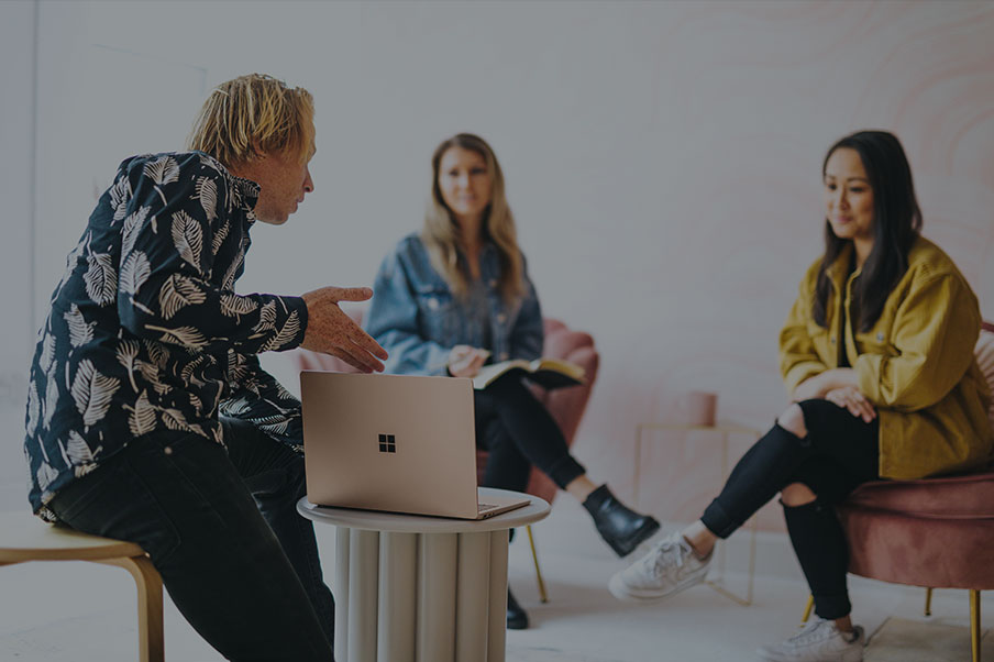 Colleagues discussing ideas around a table